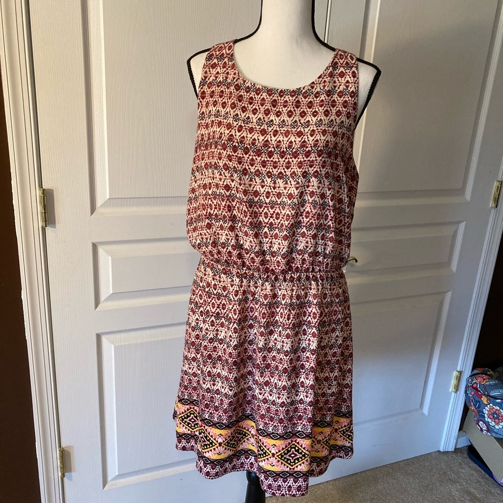Xhiliration dress. Fun print with tie back